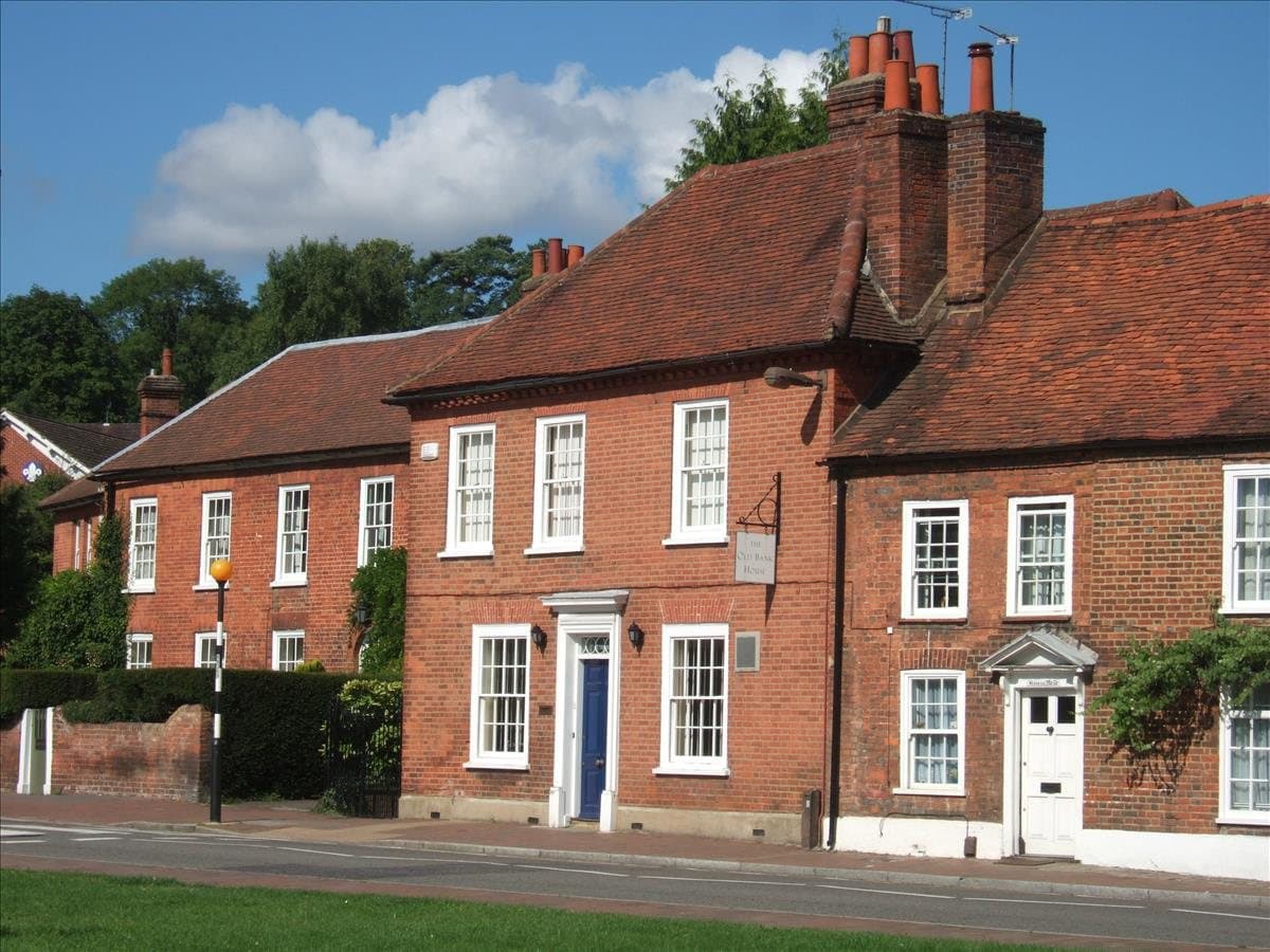 A Georgian red-brick townhouse on a village street