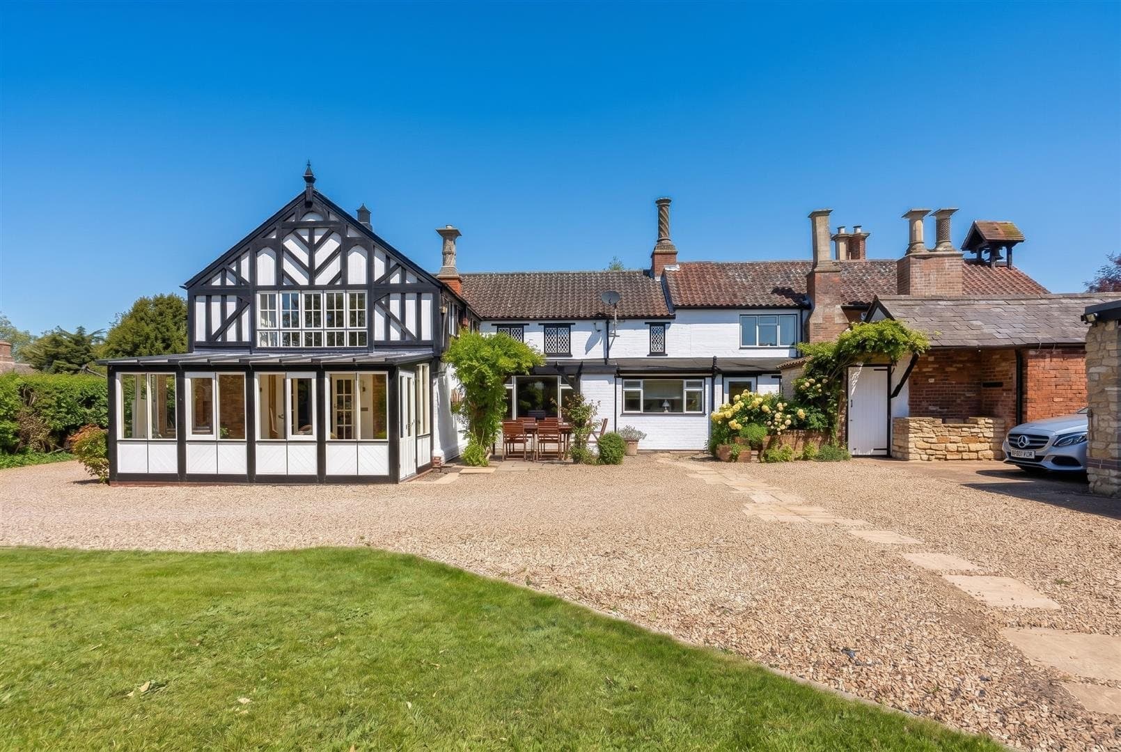 The half-timbered front of a Grade II listed house in Harlaxton